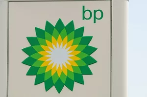 THE BRIGHT GREEN AND YELLOW BP LOGO ADORNS THE SIDE OF A SIGN