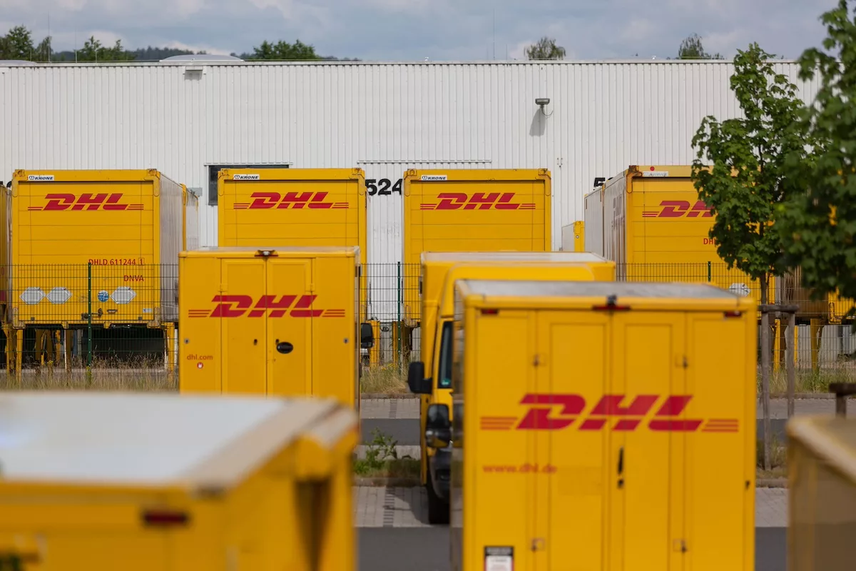 Dhl express delivery trucks istock 1325164558