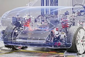 A see-through rendering of an electric vehicle sedan, where the engine and inner parts are visible through the outline of the car.
