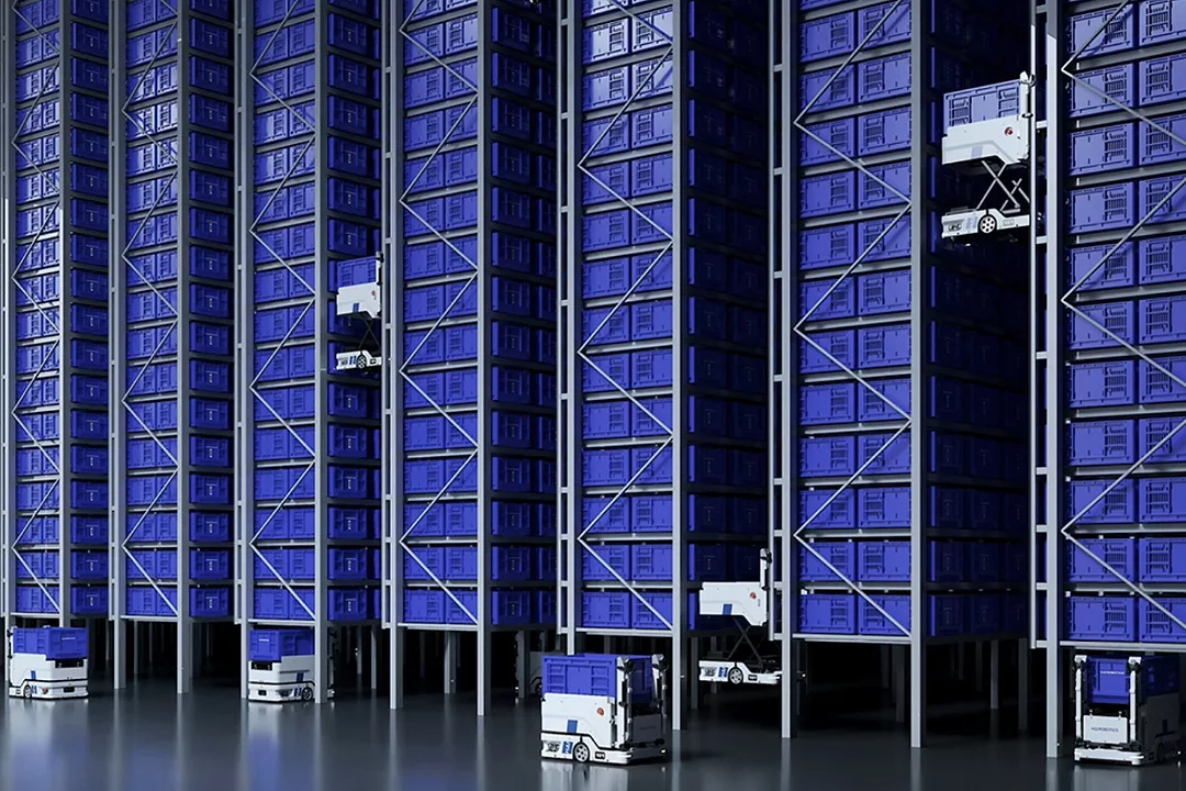 TALL STACKS IN A WAREHOUSE ARE SWARMED BY ROBOTS