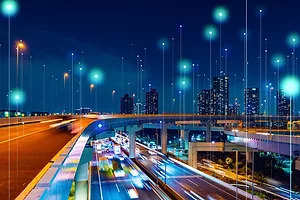 A CITY SCENE AT NIGHT, WITH MANY LINES OF LIGHT RISING FROM THE GROUND